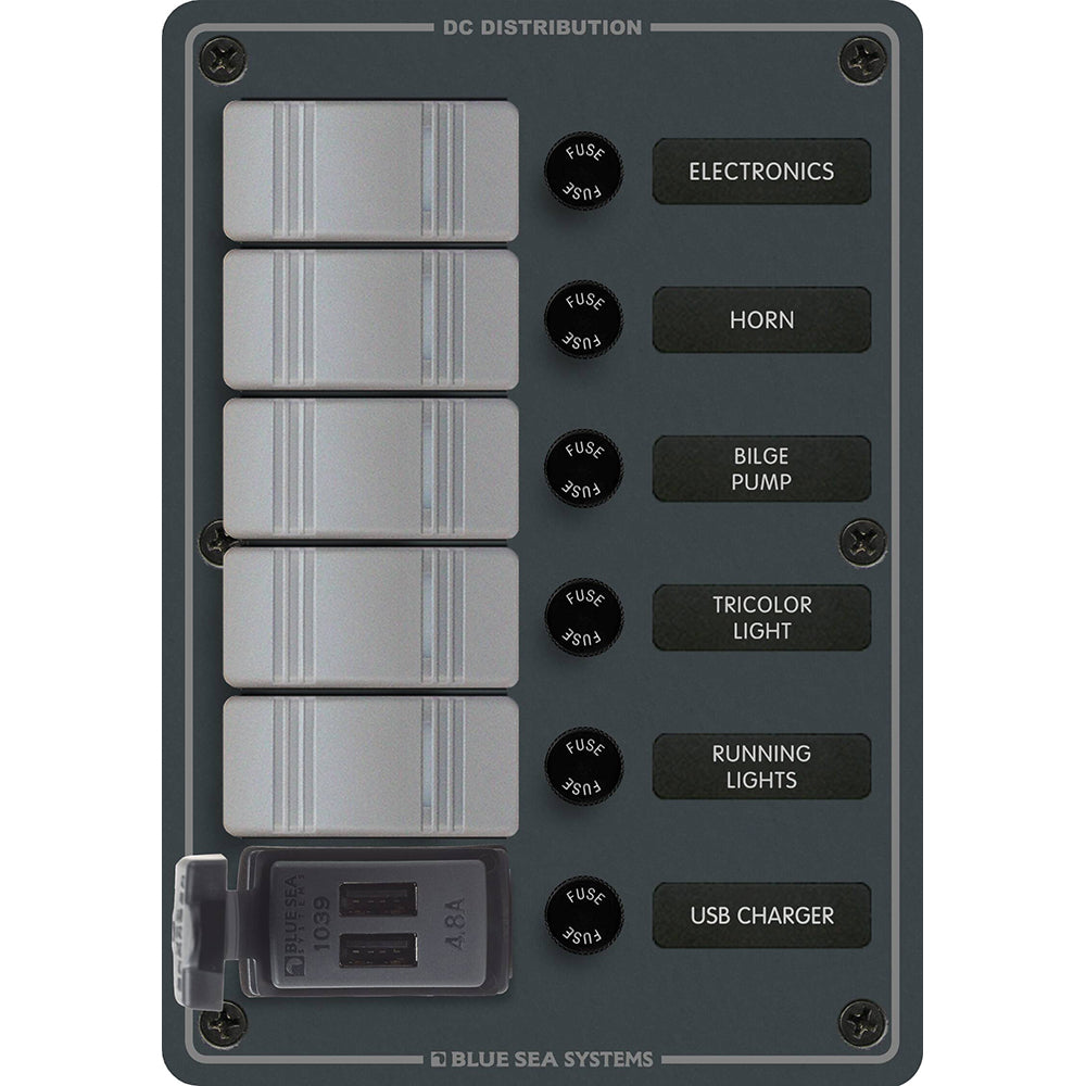 Blue Sea Systems electrical panel for a boat with a grey cover and multiple selectors.